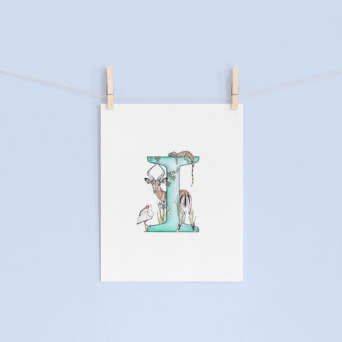 Decorative letter 'I' with illustrations of animals on a light blue background.