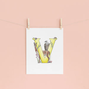 Letter 'V' print with animals on a pink wall