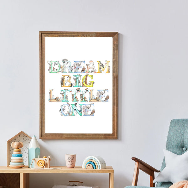 Framed artwork with 'Dream Big Little One' text in a child's room.