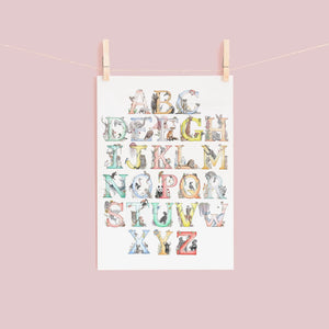 Colorful alphabet poster with animals on a pink background