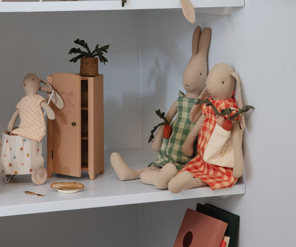 shelf display with Maileg soft toy bunnies and furnitiure